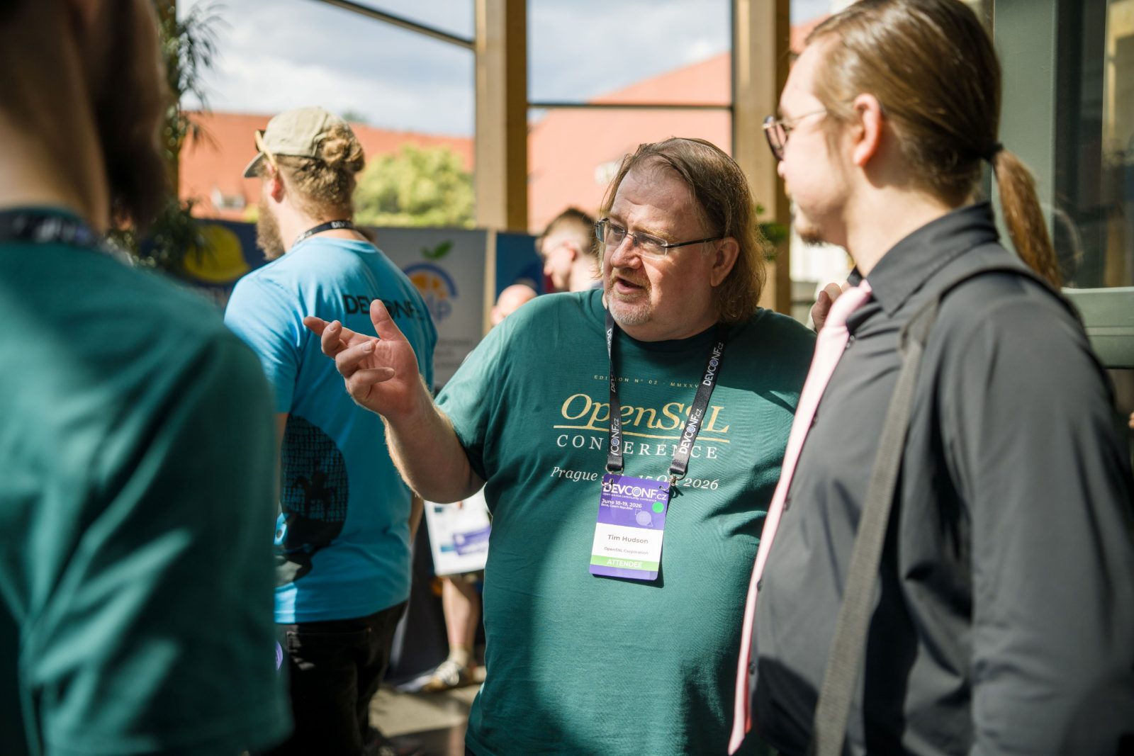 OpenSSL Corporation President Tim Hudson in conversation with attendees at DevConf.cz