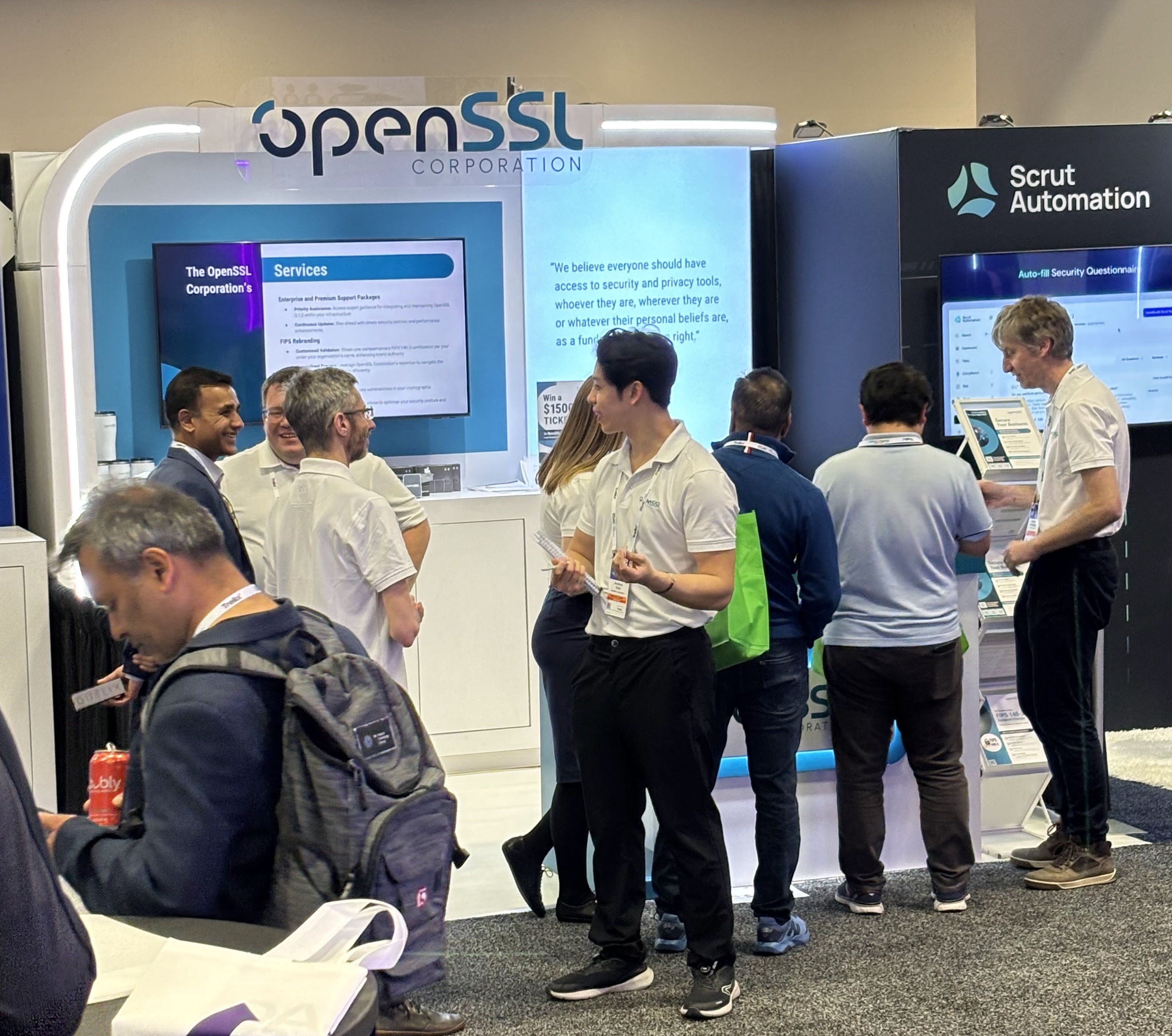 OpenSSL Corporation team interacting with attendees at the booth