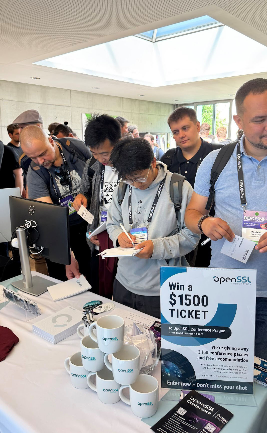 Attendees signing up for the raffle at our booth